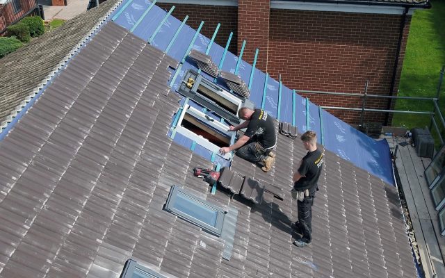 roofers replacing a roof